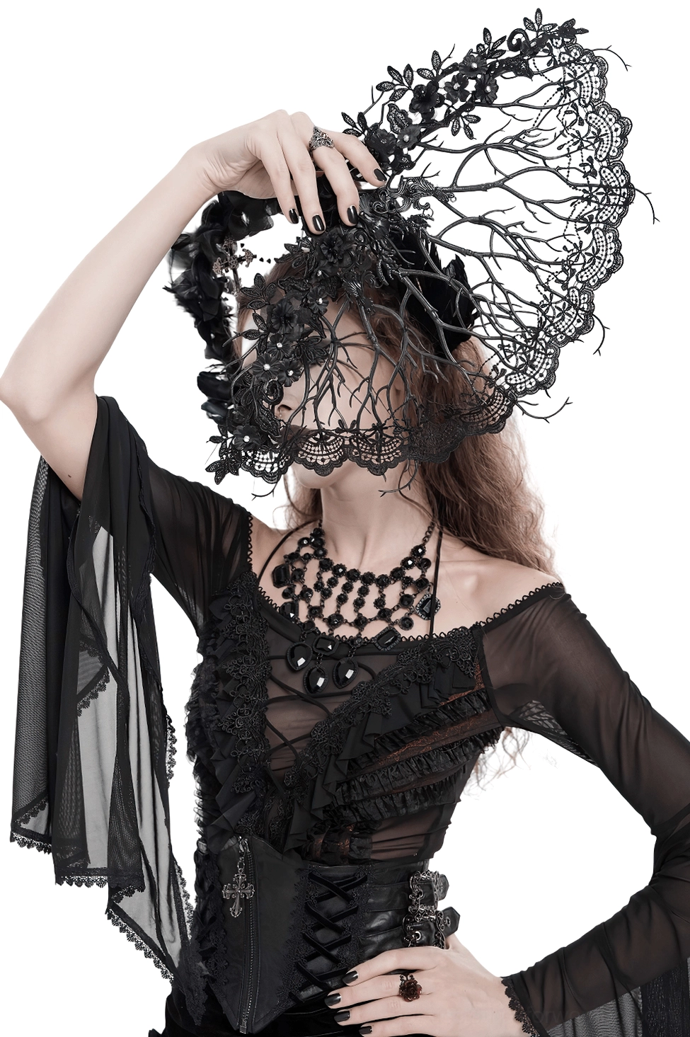 Gothic woman from behind holding ornate black lace hand fan with filigree branch structure, displaying fan placement in dark romantic ensemble