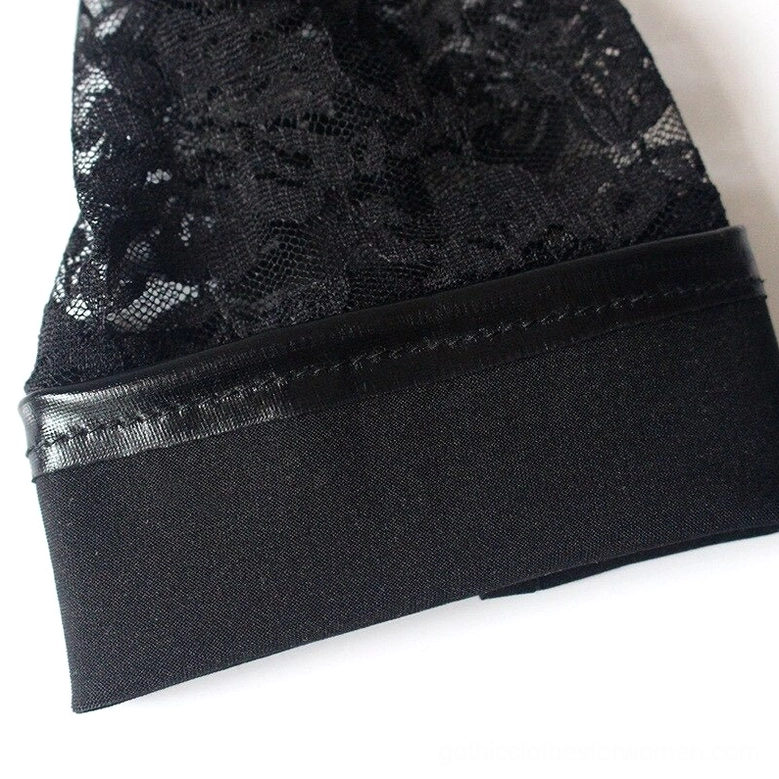 Black gothic glove cuff section detail, flat close-up showing intricate floral black lace panel and elastic fabric trim