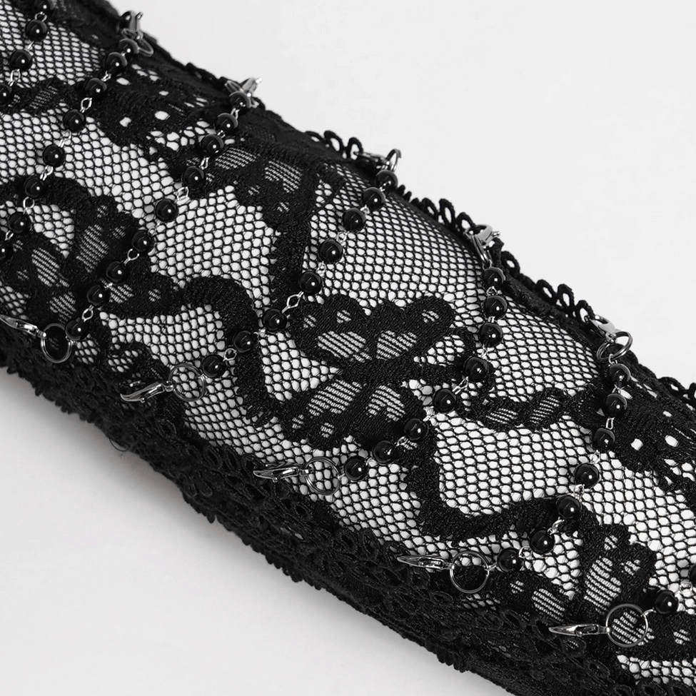 Black lace fingerless gloves showing intricate floral lace weave and transparent design