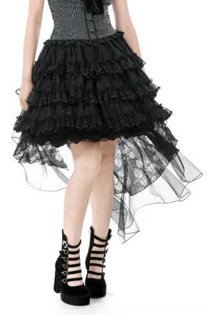 Black gothic high-low ruffle skirt worn by model with corset and platform boots, front three-quarter view