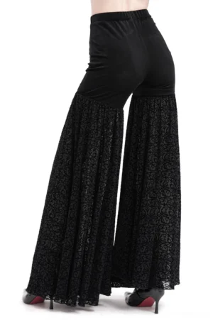 Black gothic lace palazzo pants rear view with elastic waistband, full flared lace legs, styled with high heels