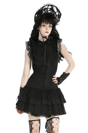 Black lace ruffled gothic dress with satin ribbon bow front view on model in studio