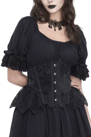 Black lace underbust corset with hook closure worn by gothic model showing front three-quarter view with puff sleeve styling and floral lace details