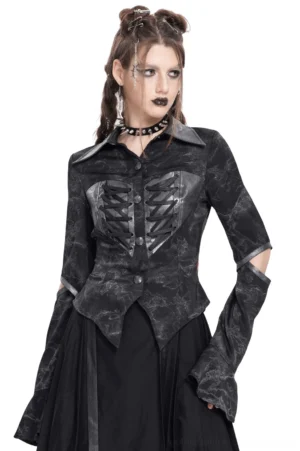 Black lace-up gothic blouse front three-quarter view showing cut-out long sleeves and corset-style chest lacing on model wearing dark accessories