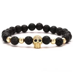Black lava stone skull beaded stretch bracelet with gold-tone skull charm and gold metal spacers – gothic jewelry for women and men