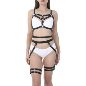 Black PU leather adjustable body harness front view on female model with thigh straps, featuring metal O-rings and buckle details