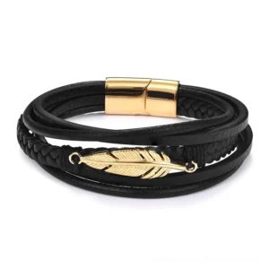 Black leather gothic bracelet with gold-toned stainless steel feather pendant, front studio product photography