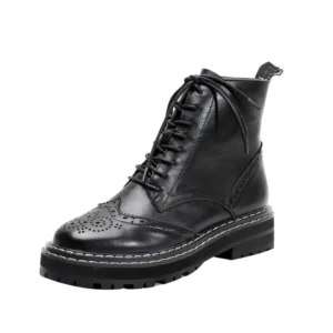 Black genuine leather gothic ankle boots with brogue cutout details and lace-up closure, side view showing ornate perforations and platform sole