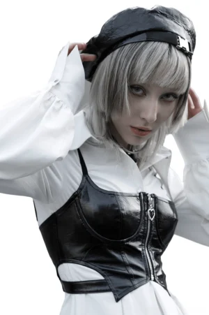 Gothic black patent leather cropped camisole layered with white long-sleeve shirt, demonstrating versatile styling options