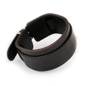 Gothic black leather cuff bracelet back view revealing adjustable strap system, suede inner lining, and toggle closure mechanism