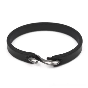 Black genuine leather gothic cuff bracelet with vintage hook clasp, front flat lay view