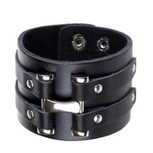 Black leather gothic cuff bracelet with silver metal hardware, flat lay front view showcasing dual-strap design and snap fasteners