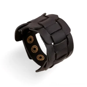Black braided leather gothic cuff bracelet with brass snap fastener, three-quarter side view showcasing distressed texture