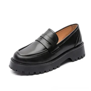 Black genuine leather gothic platform loafers with chunky lug sole, front three-quarter view on white background
