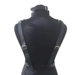 Black leather harness back view - adjustable shoulder straps and waist belt with buckle closure shown from rear on mannequin