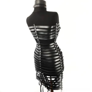 Black bondage harness dress backless design with horizontal leather straps and hanging hem detail - back three-quarter view