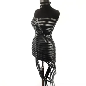 Black PU leather gothic harness dress with crisscross front straps, neck collar D-ring, and strapless design - front three-quarter view
