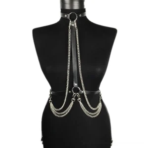 Black PU leather body harness displayed on mannequin showing layered silver chains and D-ring hardware details