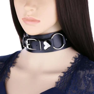 Black leather heart choker collar on female mannequin head, silver metal hardware, front wearing view against dark background