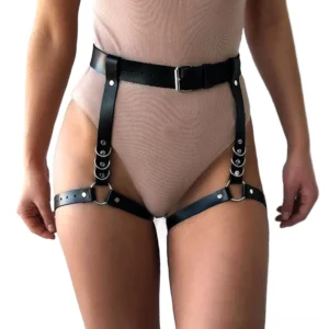 Black leather leg body harness front view on model - adjustable thigh straps with silver metal buckles and D-rings gothic bondage chain harness