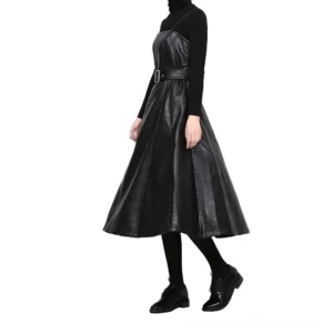 Black PU leather spaghetti strap midi dress side view with high-waist belt, paired with black stockings and leather shoes