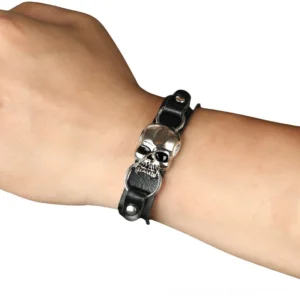 Unisex gothic skull leather bracelet worn on wrist, showing adjustable fit and metal skull detail
