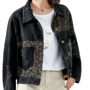 Black leopard patchwork denim jacket front view on model, featuring embroidered animal print panels and distressed details
