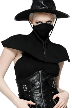 Gothic black masked hooded cape front view styled with plague doctor aesthetic and leather accessories on blonde model