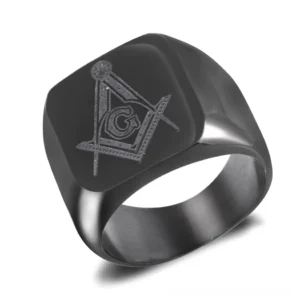 Black plated Masonic signet ring with engraved Freemason G symbol on square face, three-quarter front view