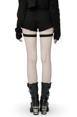 Black mesh garter shorts with adjustable straps - back full-body view on model with goth platform boots