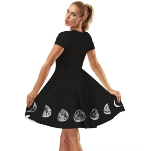 Black gothic moon dress back view showing lunar print detail on skirt hem and short sleeve construction