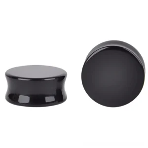 Black obsidian ear plugs and flesh tunnels with polished smooth finish, showcasing the elegant curved hourglass design and jet-black gothic aesthetic from side angle