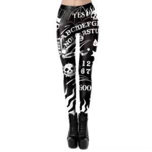 Black gothic leggings with white Ouija board print, skulls, stars and cryptic letters - front view on flat lay
