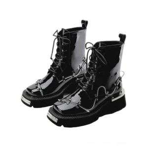Pair of black glossy patent leather combat-style gothic boots with chunky platform sole and lace-up design, front view