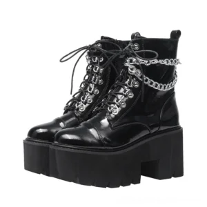 Black patent leather gothic platform boots with dual chain embellishment, front parallel view showing round toe and lace-up detail