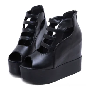 Black peep toe platform wedge sandals with cutout straps, front three-quarter view showing dual strap design and gothic aesthetic