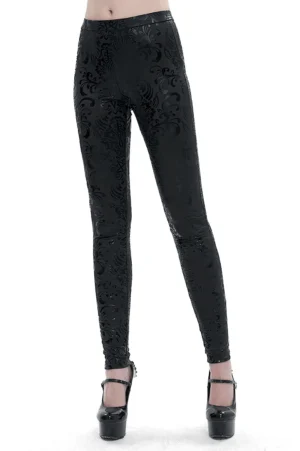 Black pentagram and floral embossed gothic leggings front view on model