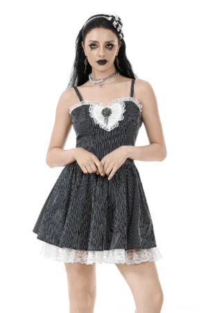 Black pinstripe gothic corset dress with heart lace neckline and ruffled hem, front full-body view on model