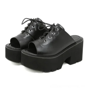Black platform lace-up mule sandals three-quarter front view showing open toe slip-on design