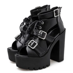 Pair of black platform sandals showing cutout ankle straps and faux leather material detail, studio white background