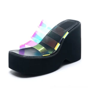 Single black platform wedge slipper three-quarter front view featuring dramatic heel height and open-toe construction