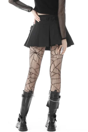 Black pleated gothic mini skirt back view showing A-line silhouette and pleated fabric detail with model wearing combat boots
