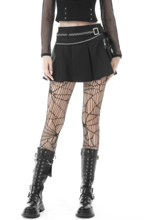 Black pleated gothic mini skirt with chain belt worn by model in full front view with fishnet stockings and combat boots on white background