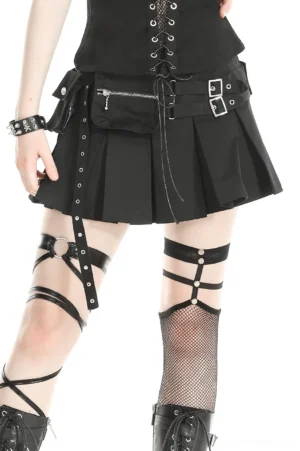 Black pleated gothic mini skirt with silver metal buckle straps, front low angle view showing punk utility aesthetic