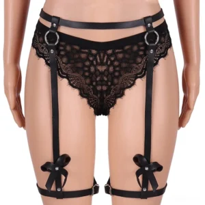 Women's black PU leather thigh harness with bow embellishments on model mannequin, front close-up view showing waist belt and adjustable leg straps
