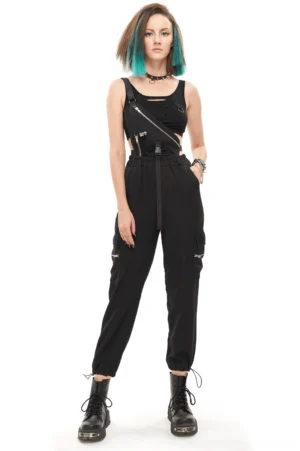 Black asymmetric punk overalls with skull rivets and adjustable shoulder strap, front oblique studio view