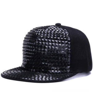 Black pyramid stud snapback cap front three-quarter view with full stud coverage and flat brim