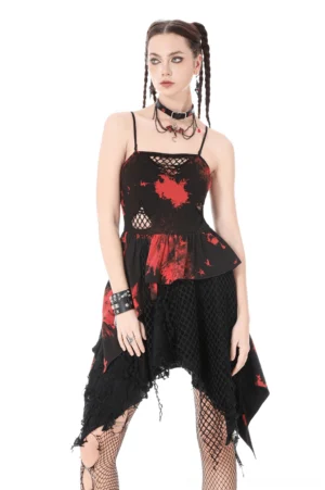 Black and red tie-dye gothic dress with mesh cutouts and asymmetrical ruffled hem, front full-body view on model with punk braided hairstyle