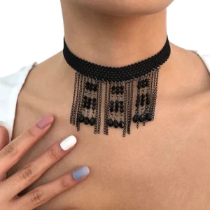 Black rhinestone tassel gothic choker necklace worn on female model's neck with manicured hand detail, showing woven fabric collar and dangling crystal pendants