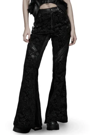 Black rose jacquard flared gothic pants front three-quarter view on model - faux leather side accents and zipper details